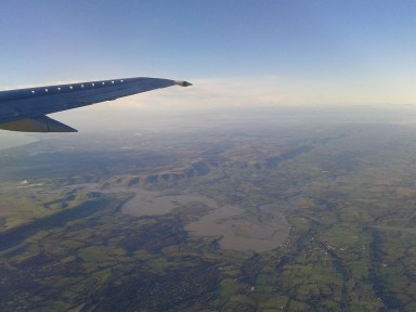 Departing a sodden England. The river in the near foregound is probably the River Arun. My home in Ringwood is somewhere on the horizon at right.