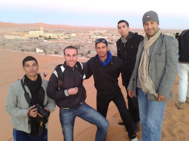 Our first sunset as viewed from the top of a desert sand dune. From left: Oussama, Sofian, Jemal, Gilour and Ahmed. Béni Abbès.