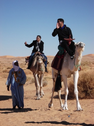 Sofian Gilmour and Oussama with camel owner in close attendance. near Béni Abbès. 
