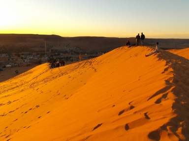 The evening sun on a dune facing the town. Taghit.